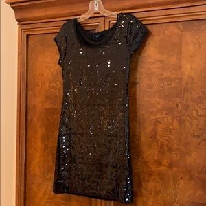 Black sequined short sleeved mini dress.